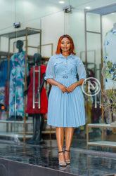 Elegant light blue skater dress with pleats